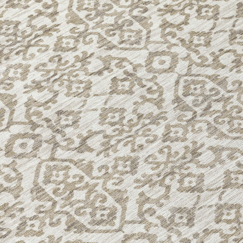 Ivory and beige damask area rug close-up with repeating ornate medallion motif