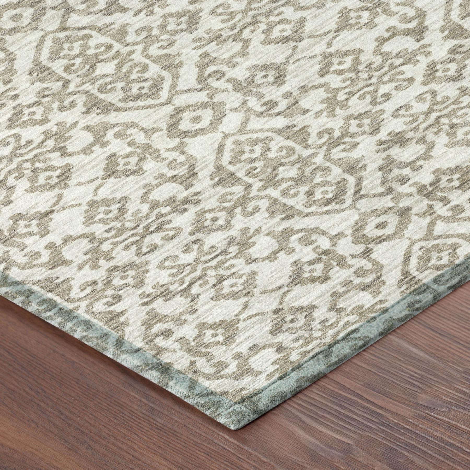 Ivory and beige damask patterned area rug with textured short pile and border