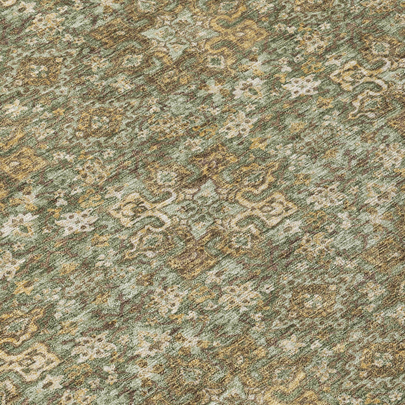 Olive green area rug close-up with cream and tan damask pattern