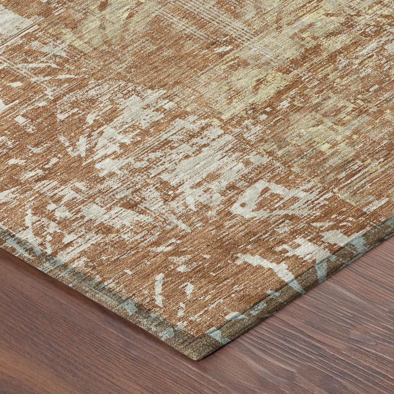 Orange and beige abstract area rug corner with low-profile bound edge