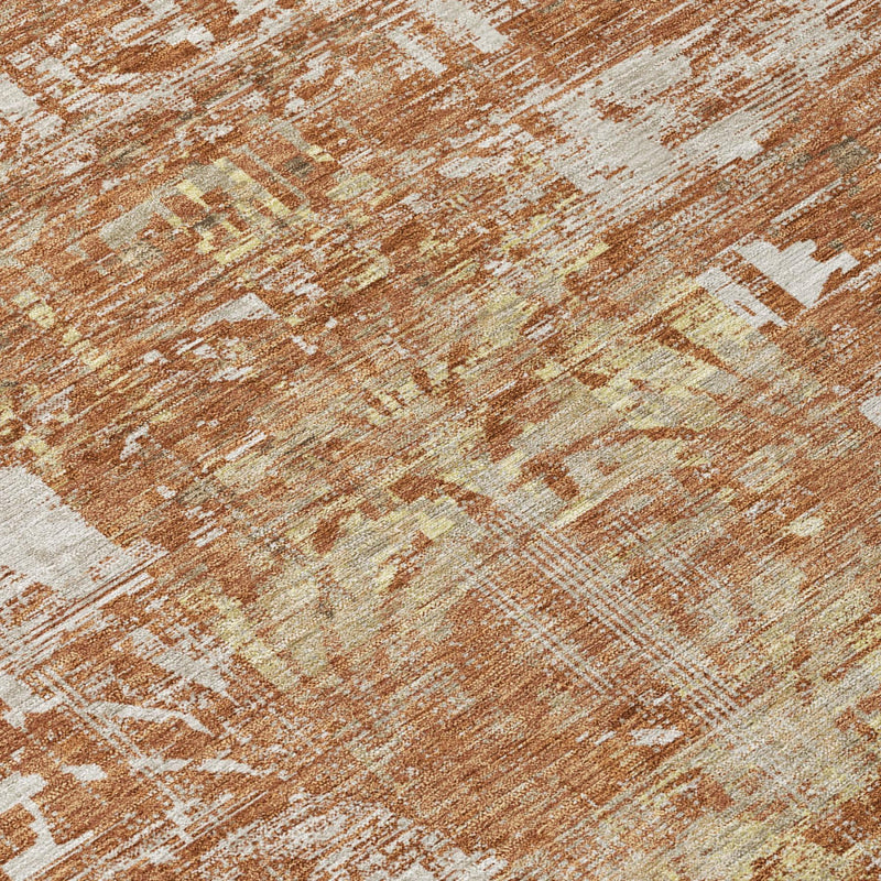 Textured orange and beige abstract rug surface with distressed pattern