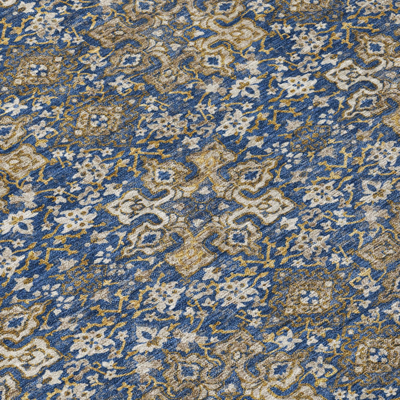 Blue damask rug with gold and navy ornate pattern detail
