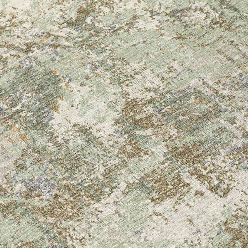 Close-up of abstract washable area rug in sage green and beige distressed texture