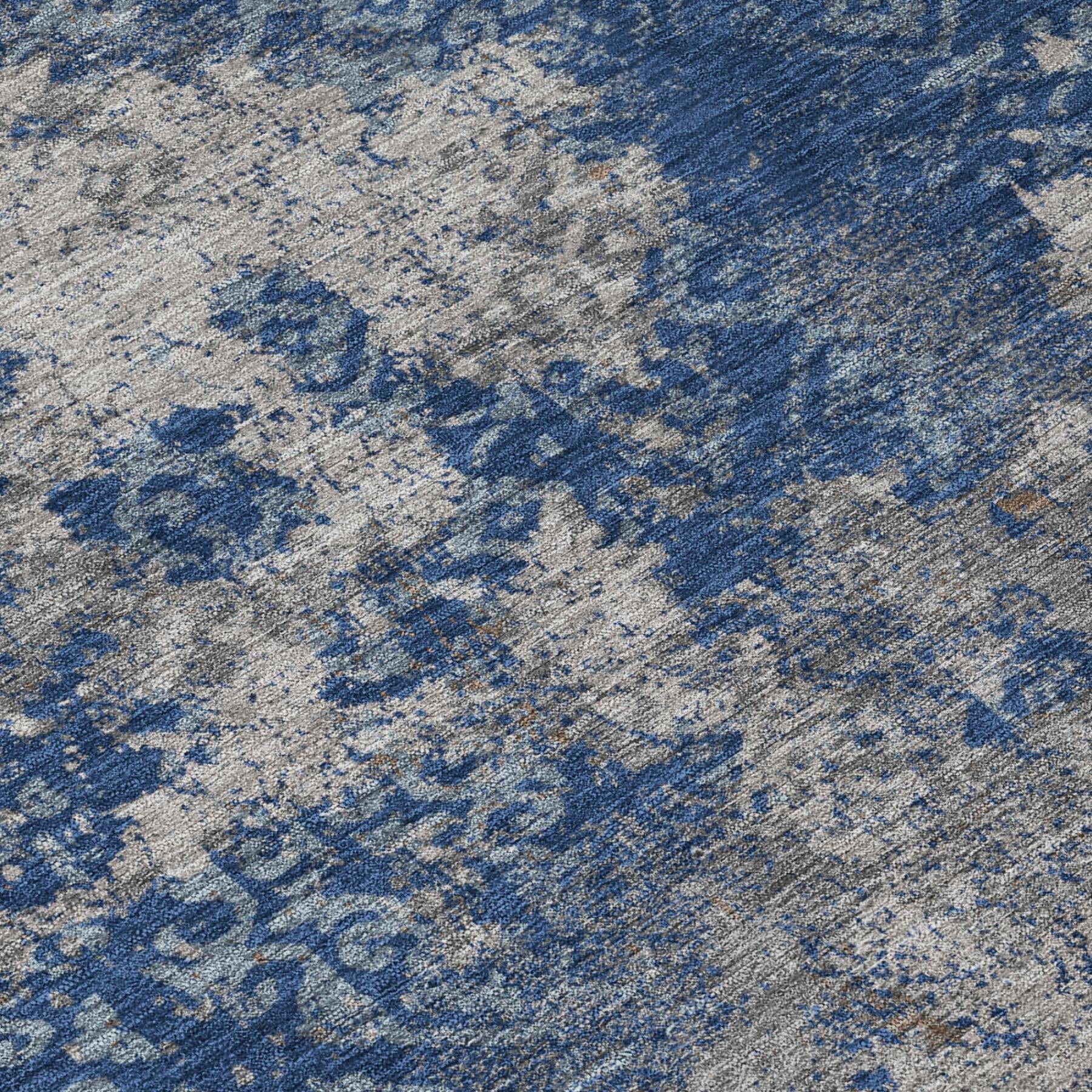 Close-up of round abstract area rug with blue and gray mottled pattern