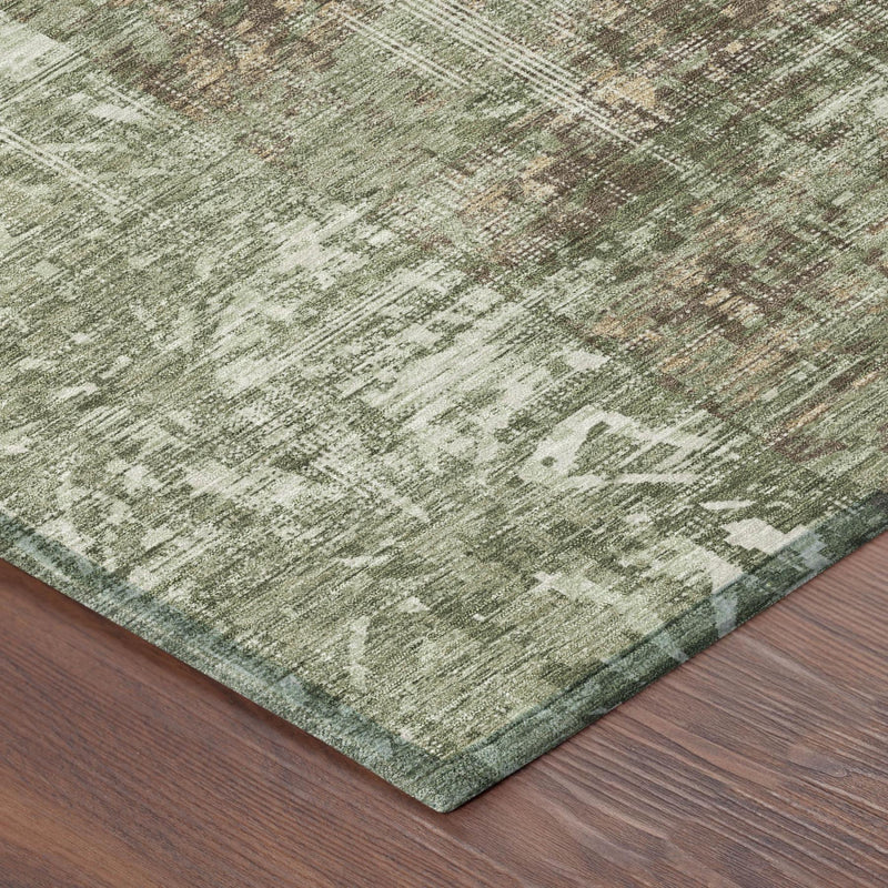 Corner of round area rug showing distressed abstract weave in olive green