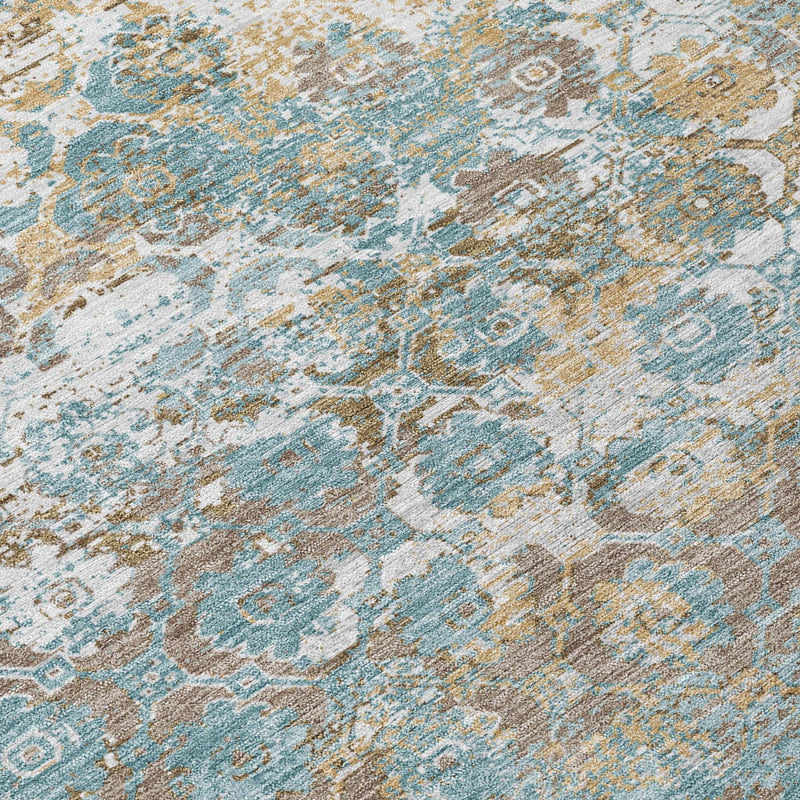 Close-up of teal blue and pewter distressed floral medallion area rug texture