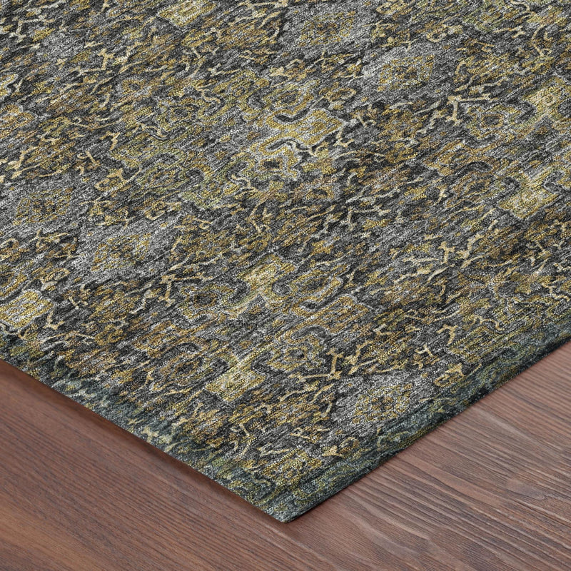 Corner view of blue-gray damask rug with gold ornate pattern and bound edge