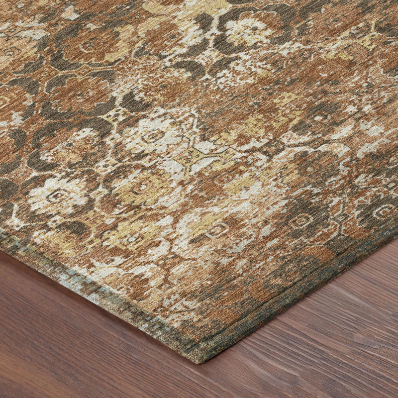 Orange and rust floral medallion area rug corner detail, distressed texture and border
