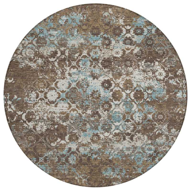 Round area rug featuring an ornate medallion floral pattern in brown and teal on cream