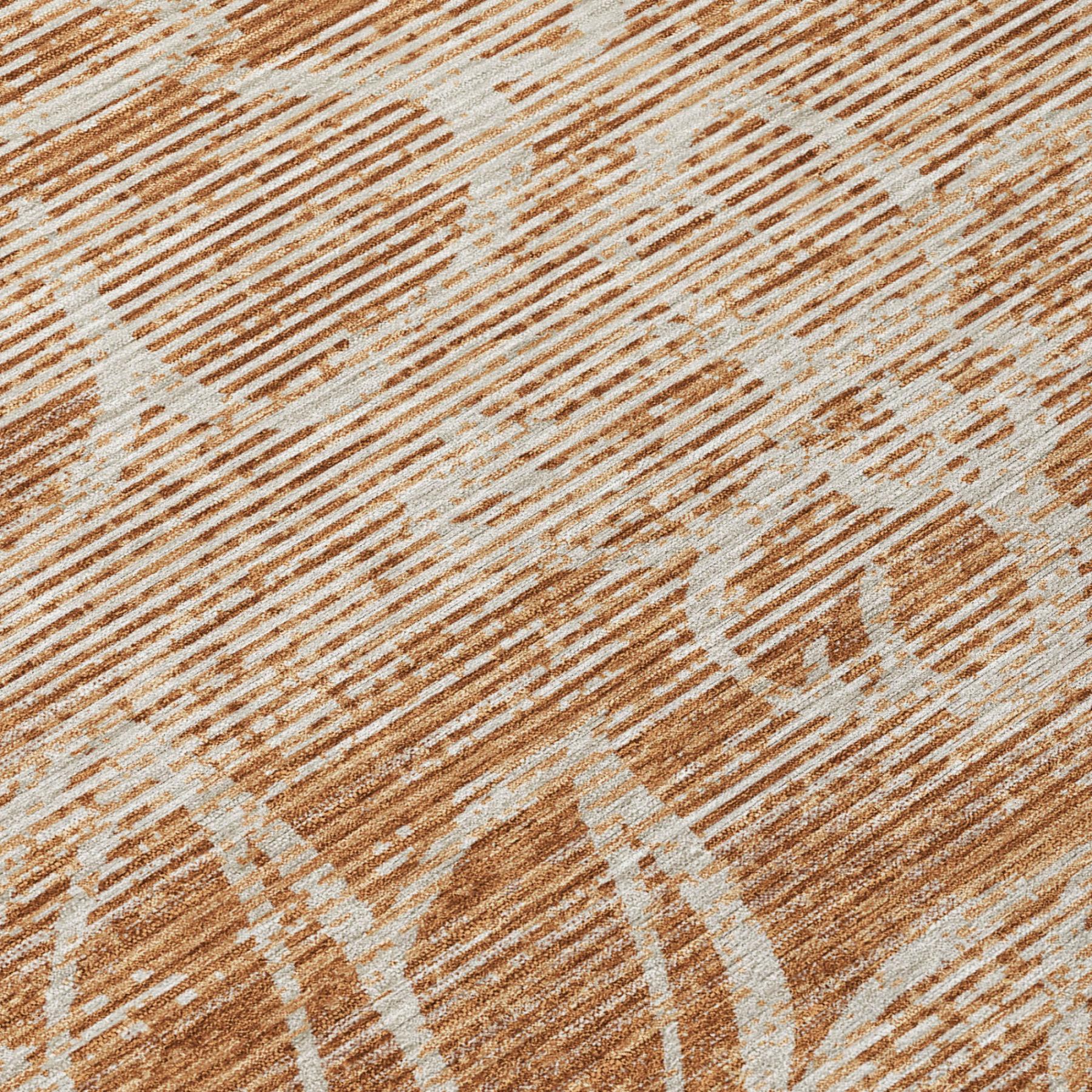 Orange and rust floral rug close-up with distressed lines and texture
