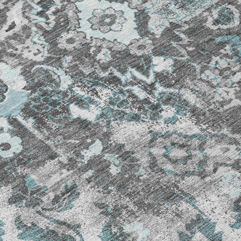 Silver, gray, and light blue distressed floral rug pile detail