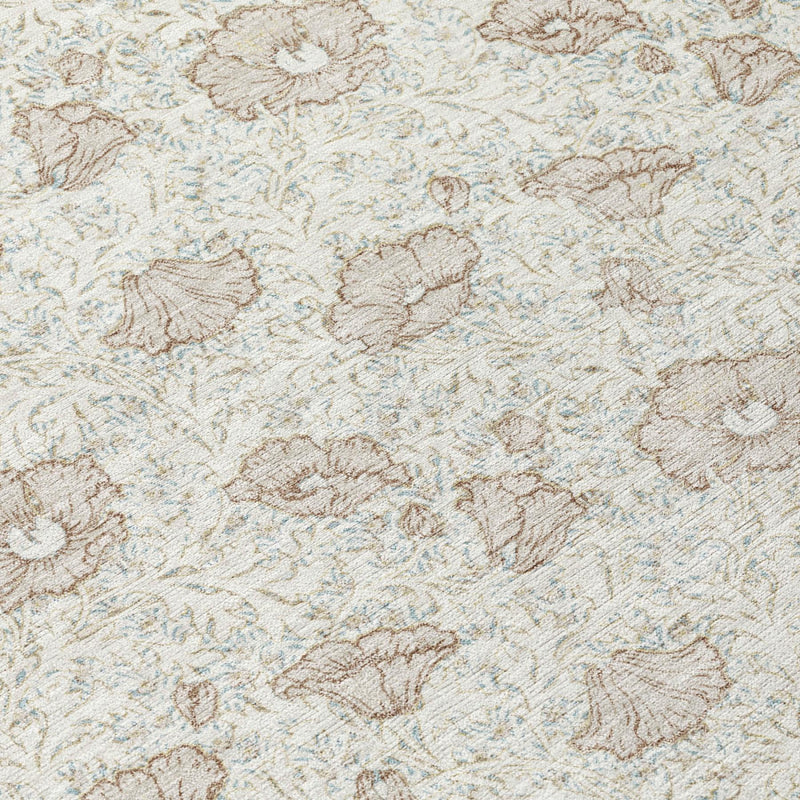 Close-up of ivory rug with distressed floral damask pattern in pearl and tan