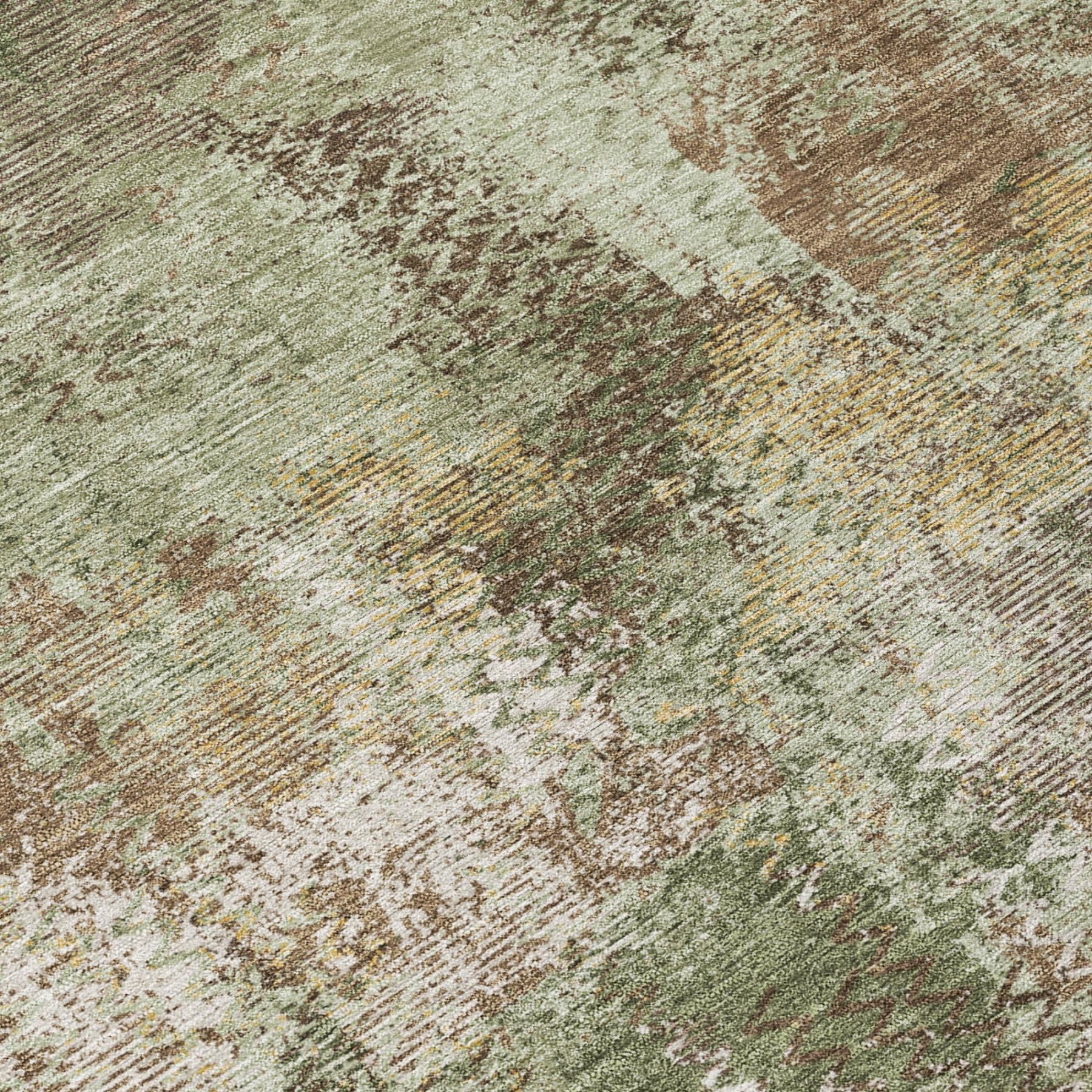 Olive green abstract area rug close-up, speckled washed effect and texture.