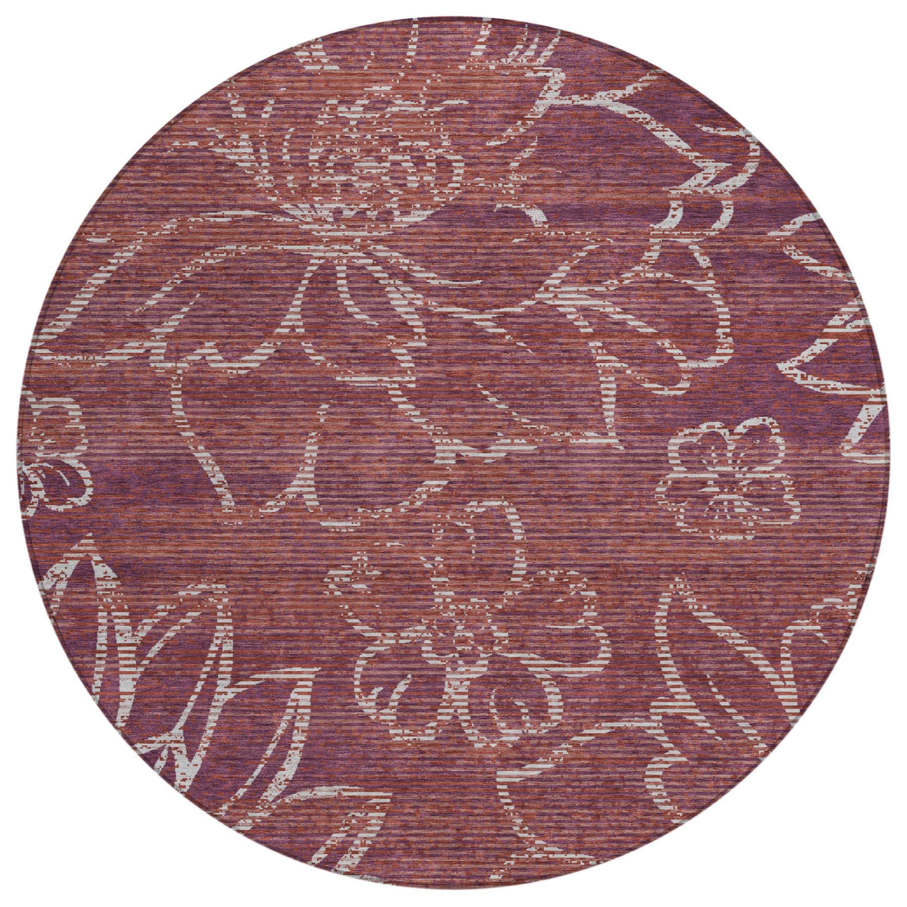 Round maroon rug with distressed white floral motifs, washable indoor/outdoor