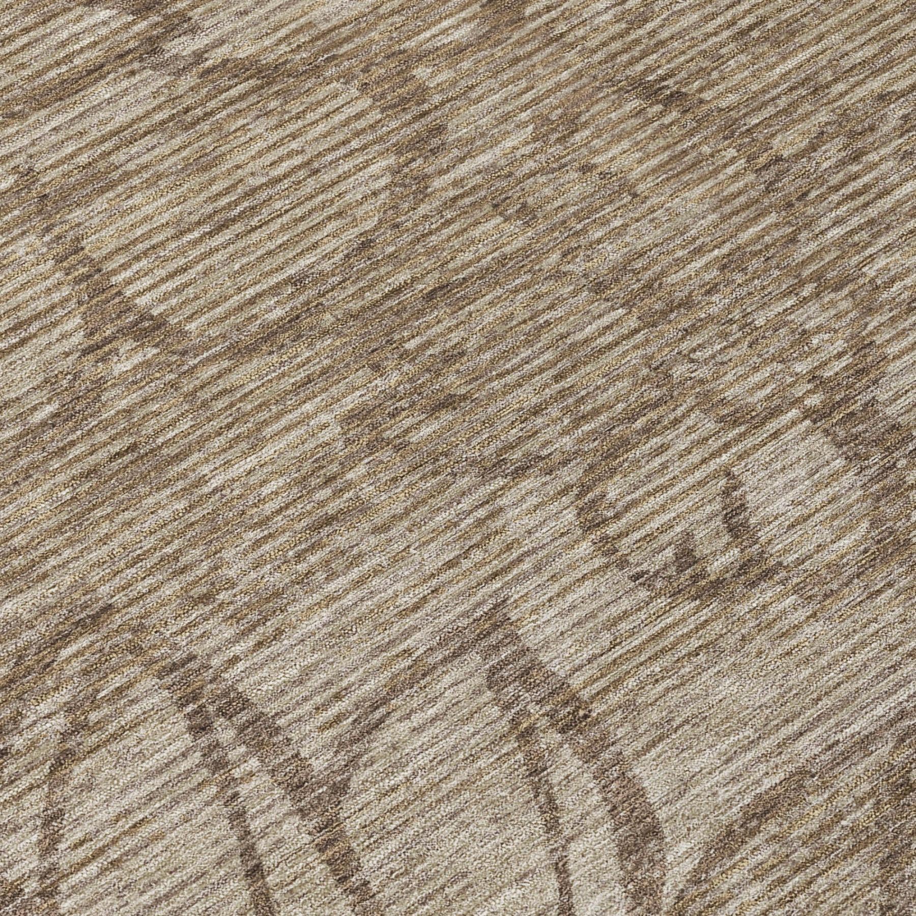 Beige rug close-up with brown vine and floral outlines on textured flat-weave surface