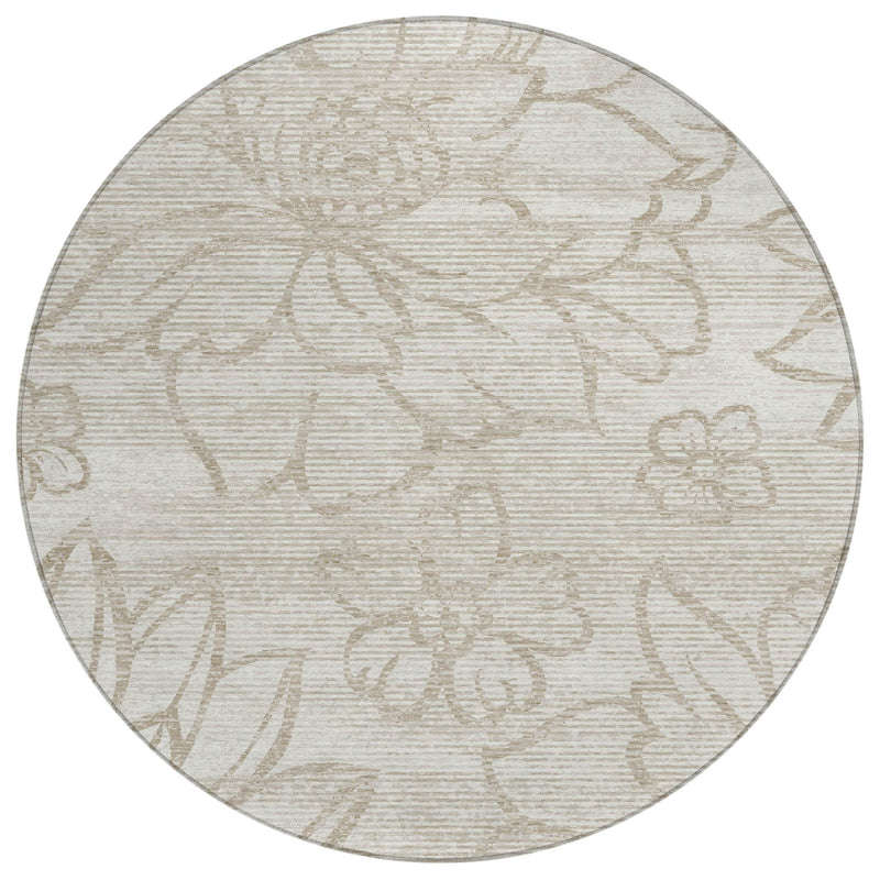 Ivory round area rug with silver-toned floral pattern for indoor or outdoor