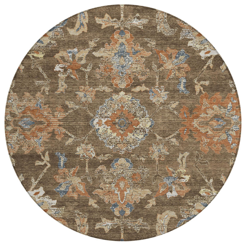 Round brown area rug with multicolor distressed floral medallion and geometric motifs
