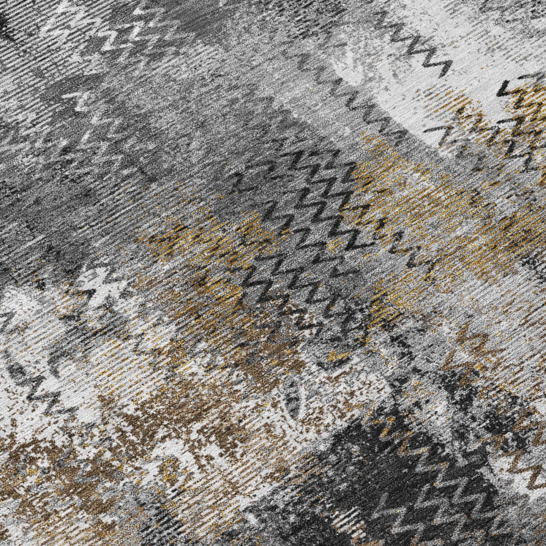 Close-up abstract area rug in gray with white and mustard accent stitches