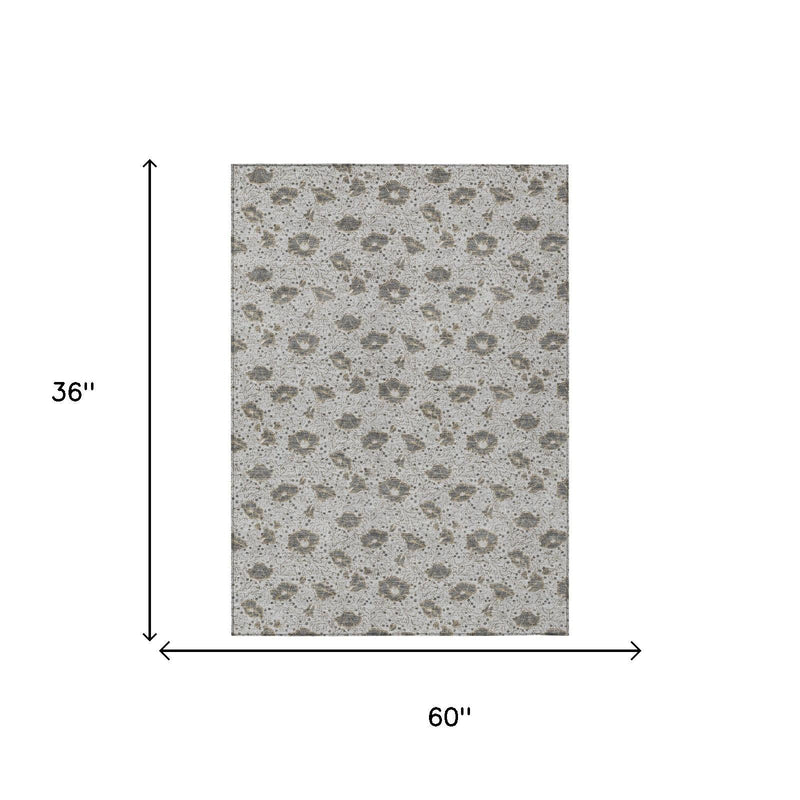 Silver and gray area rug size 60 in by 36 in with distressed floral pattern