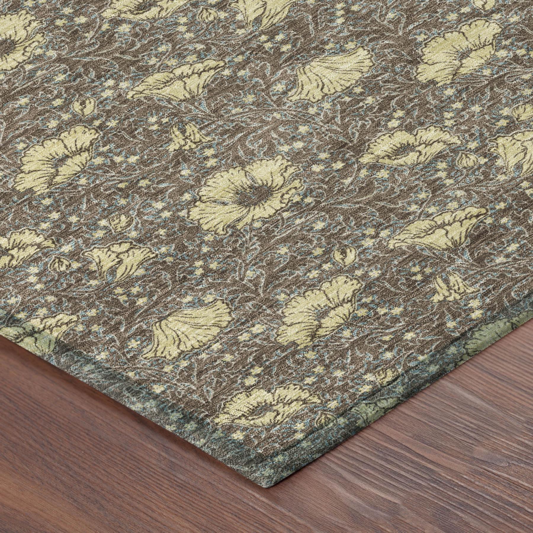 Close-up corner of round area rug with brown, coffee, and blue floral design