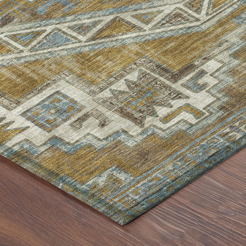 Southwestern area rug corner, worn texture, ivory, teal-blue, and gold geometric motifs