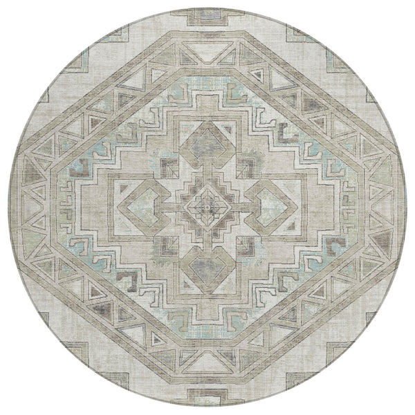 Round area rug with ivory base and pewter Southwestern geometric medallion