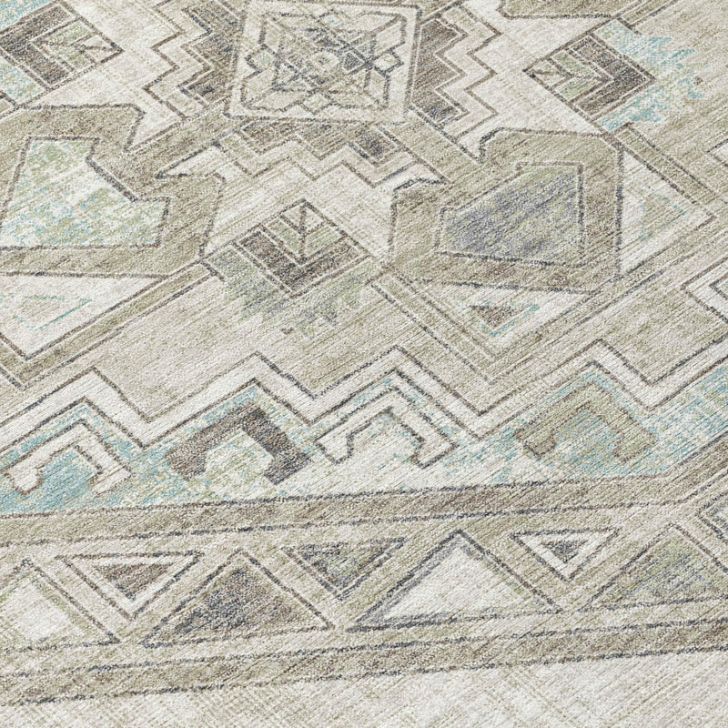 Rug surface close-up with Southwestern motifs in ivory, pewter, and light aqua accents