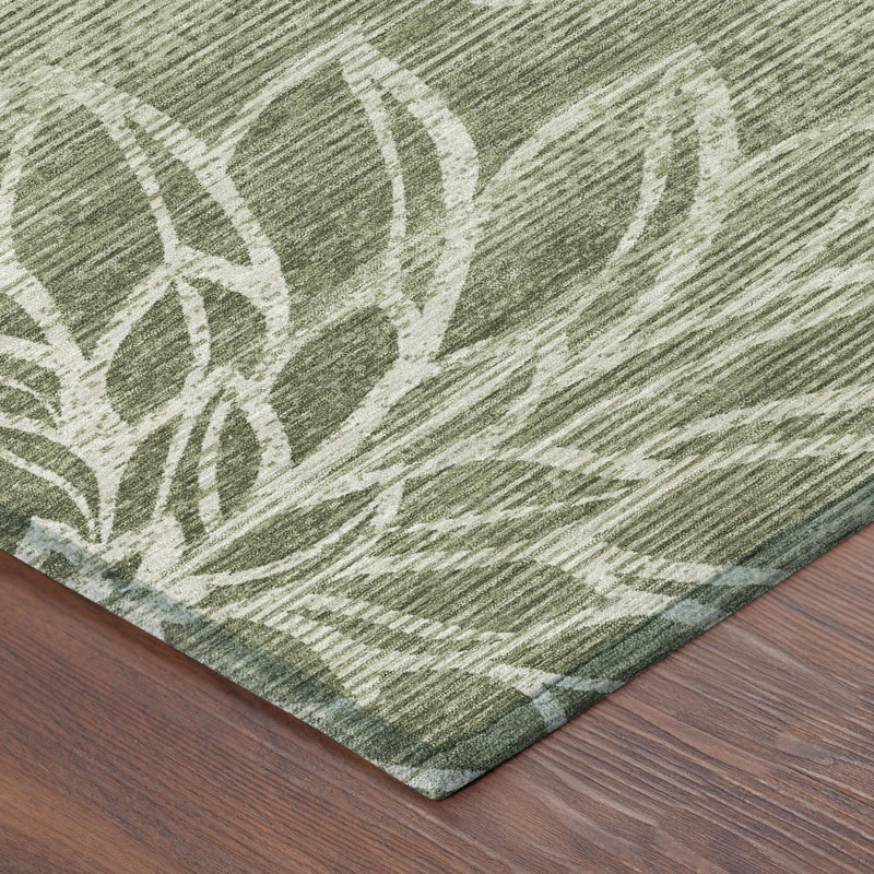 Rug corner detail: olive green border with cream botanical floral print