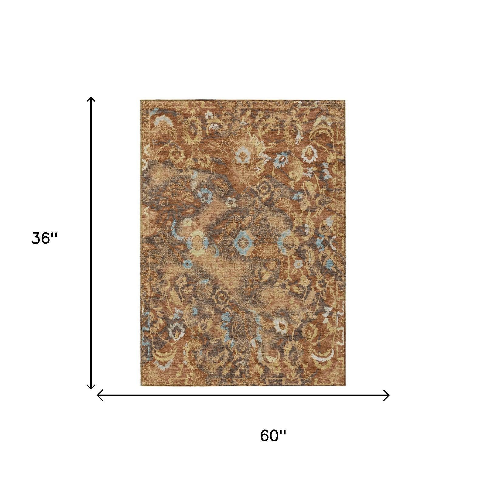 Floral area rug, 60 in x 36 in, rust and tan with blue details