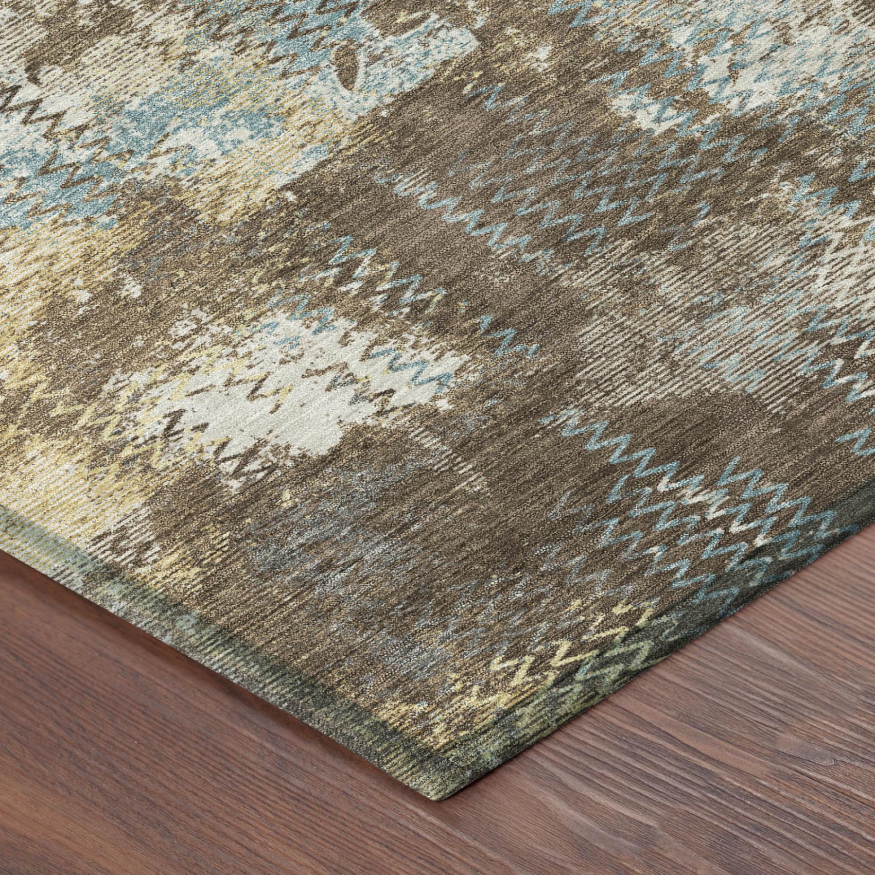 Round abstract area rug with brown, cream, and light blue distressed pattern