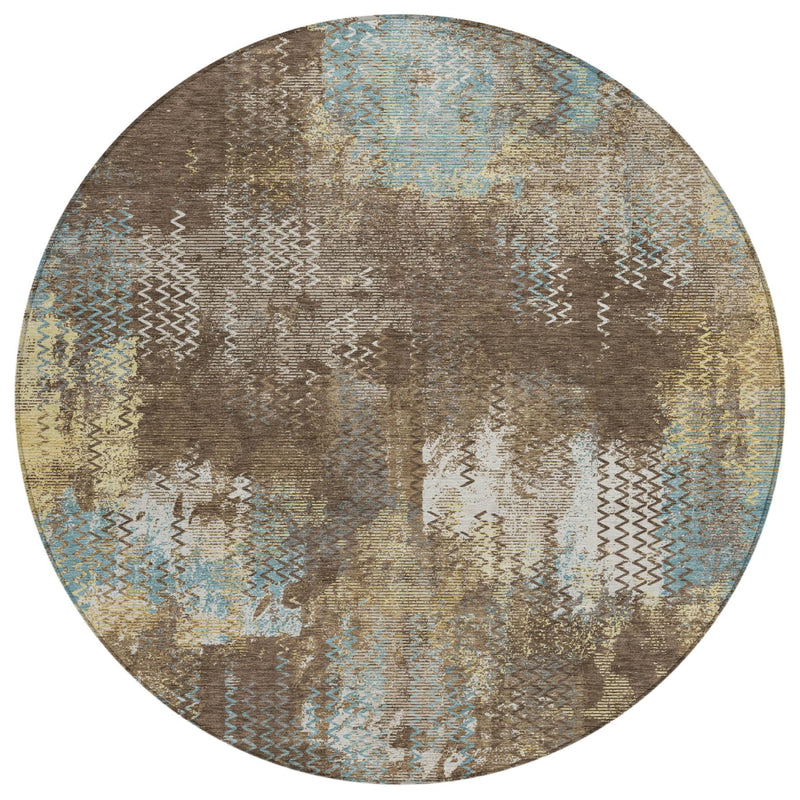 Round abstract area rug with beige, brown, cream, and blue patchwork texture