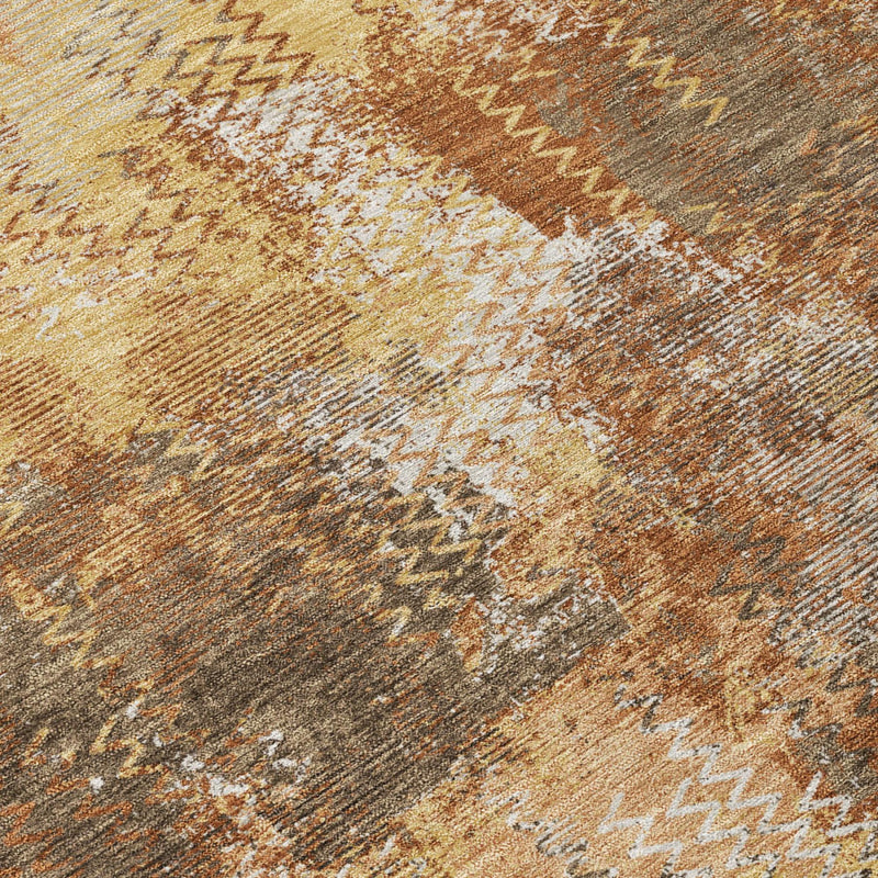 Close-up abstract rug texture with zigzag and mottled copper, orange, beige and gray