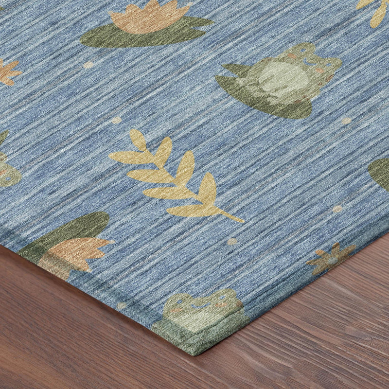 Blue botanical leaf area rug corner with olive green and orange leaf prints