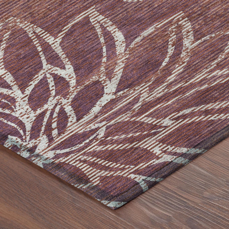 Eggplant purple floral indoor/outdoor area rug corner with ivory distressed detail