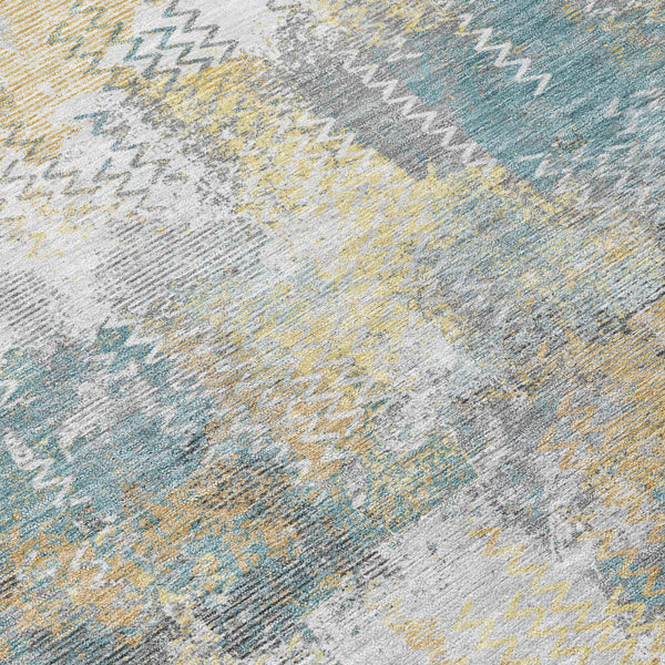 Abstract area rug with silver and gray wash effect, pale yellow and blue accents