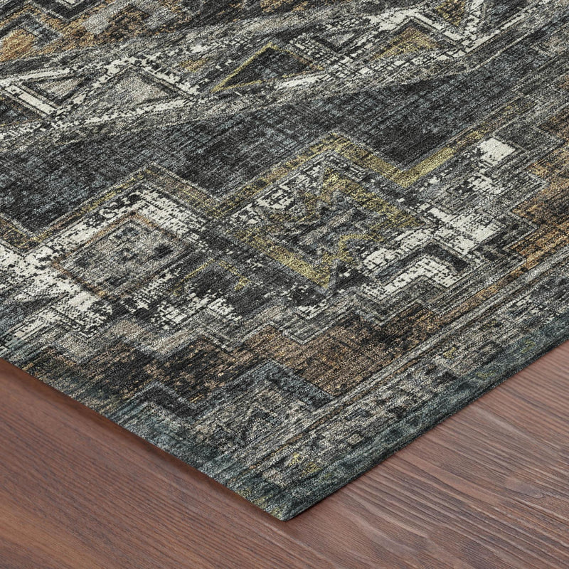 Southwestern area rug corner with distressed dark gray weave and gold-tan highlights