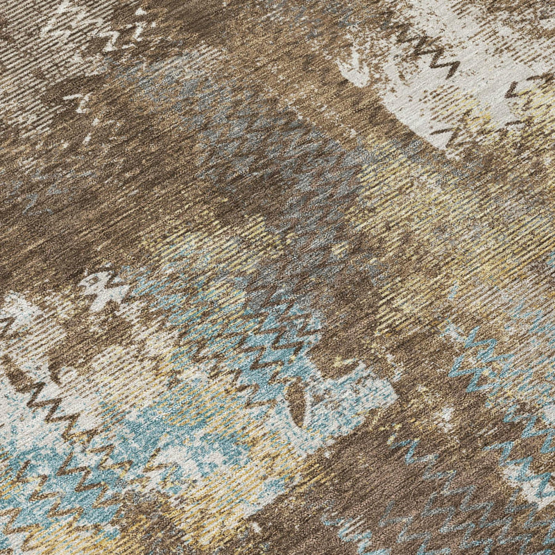Abstract area rug close-up with brown base, cream highlights, and light blue accents