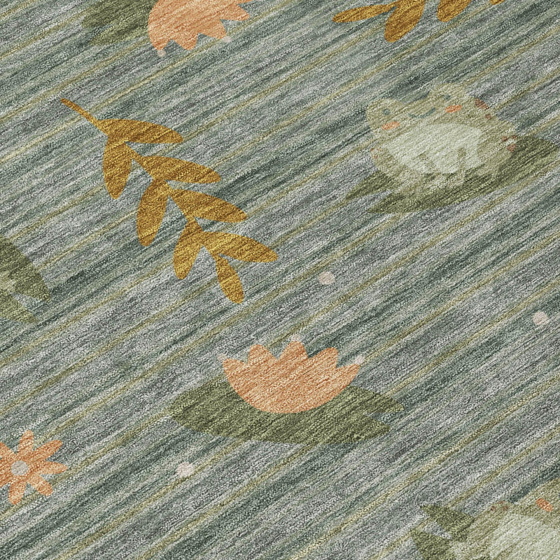 Close-up of round rug fabric with blue-gray stripes and botanical leaf motifs