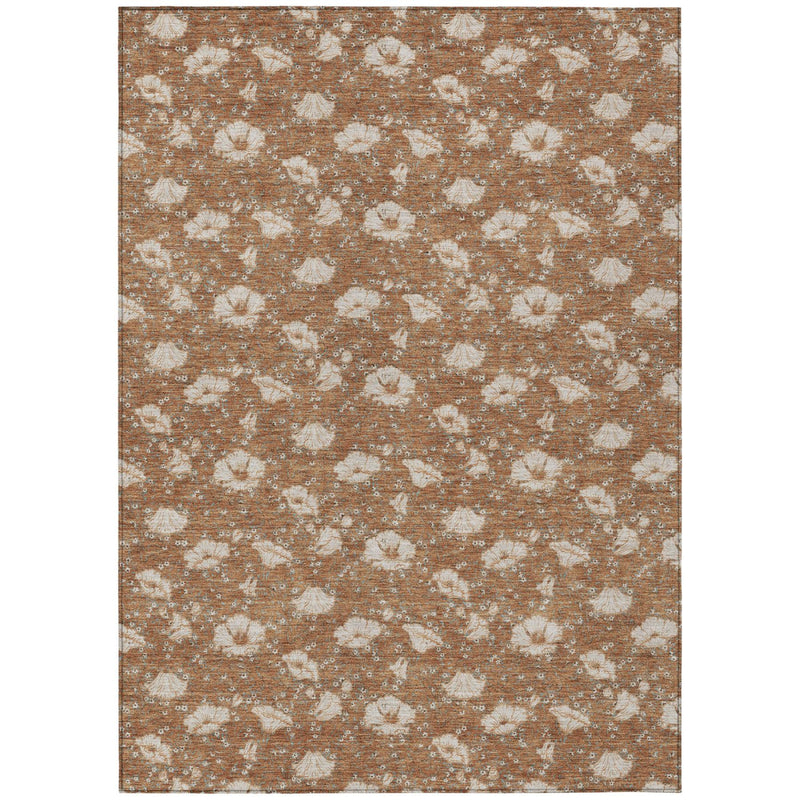 Rust and orange area rug, rectangular with beige distressed floral pattern