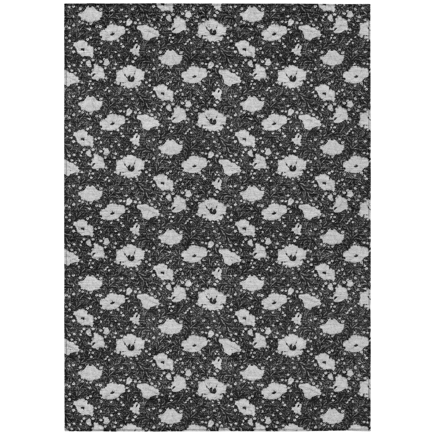 Rectangular floral area rug with repeating black and light gray medallion pattern