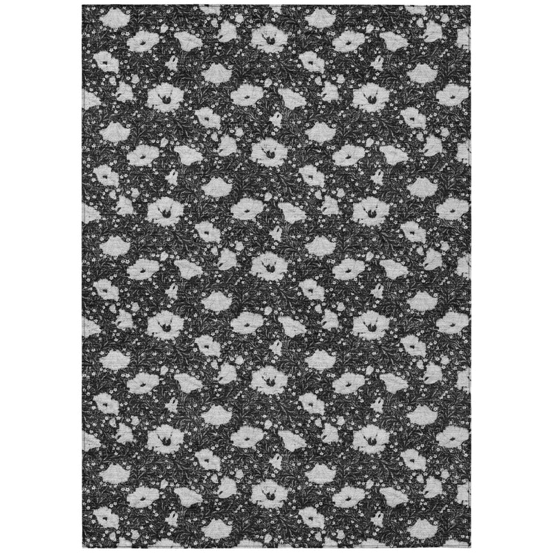 Rectangular floral area rug with repeating black and light gray medallion pattern