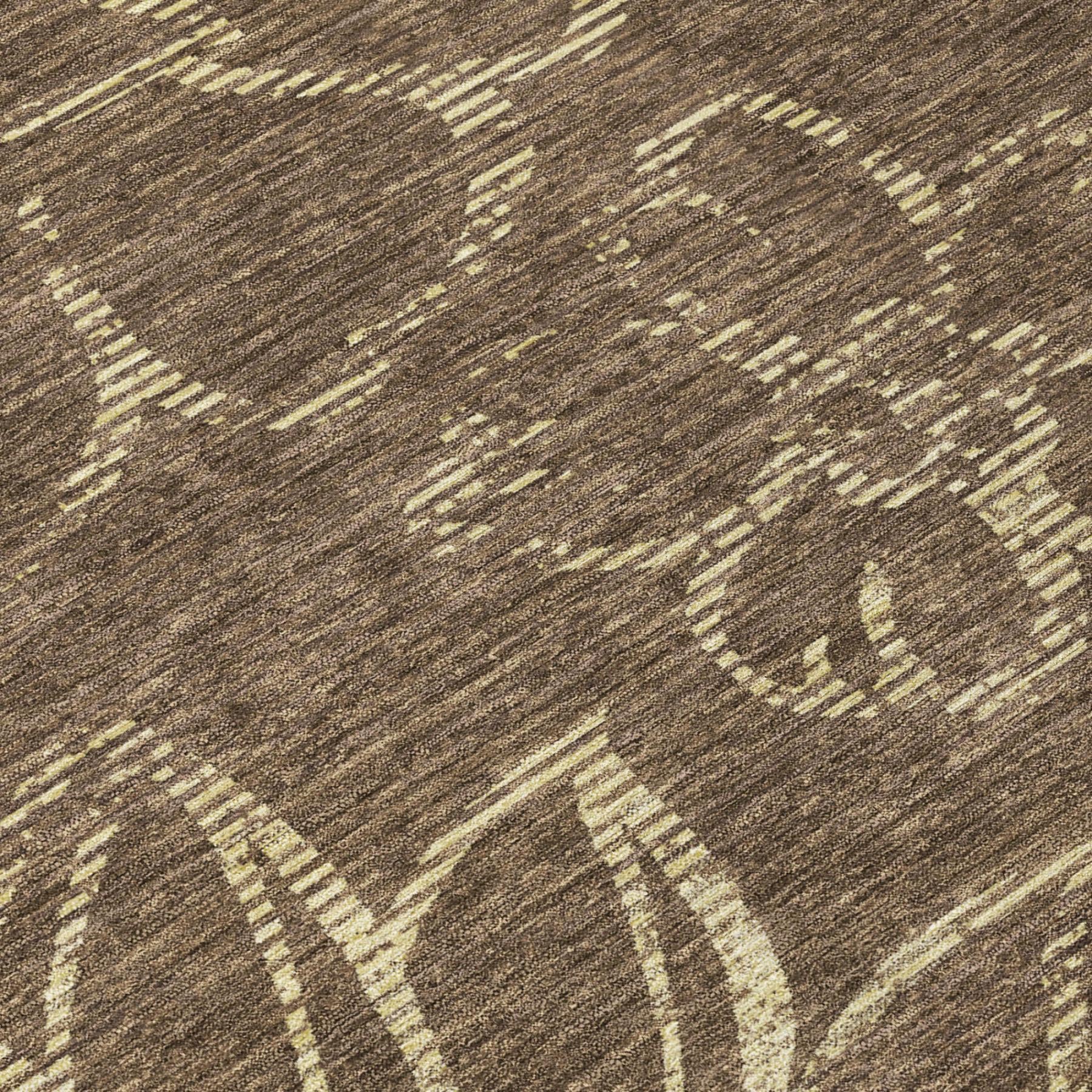Brown area rug close-up with cream distressed botanical motif and detailed lines