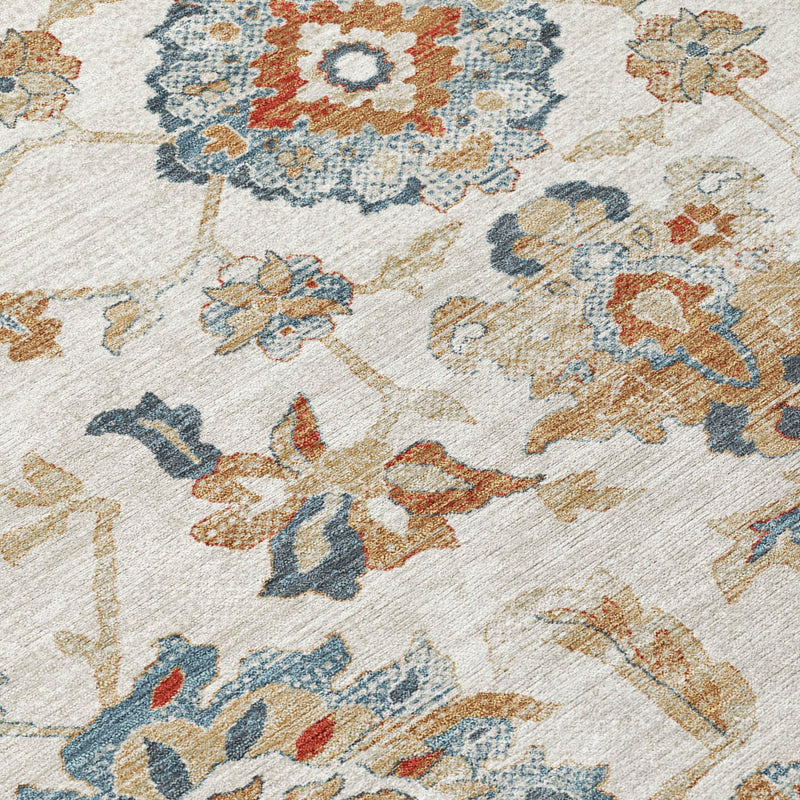 Close-up of ivory floral medallion rug with blue and rust botanical details