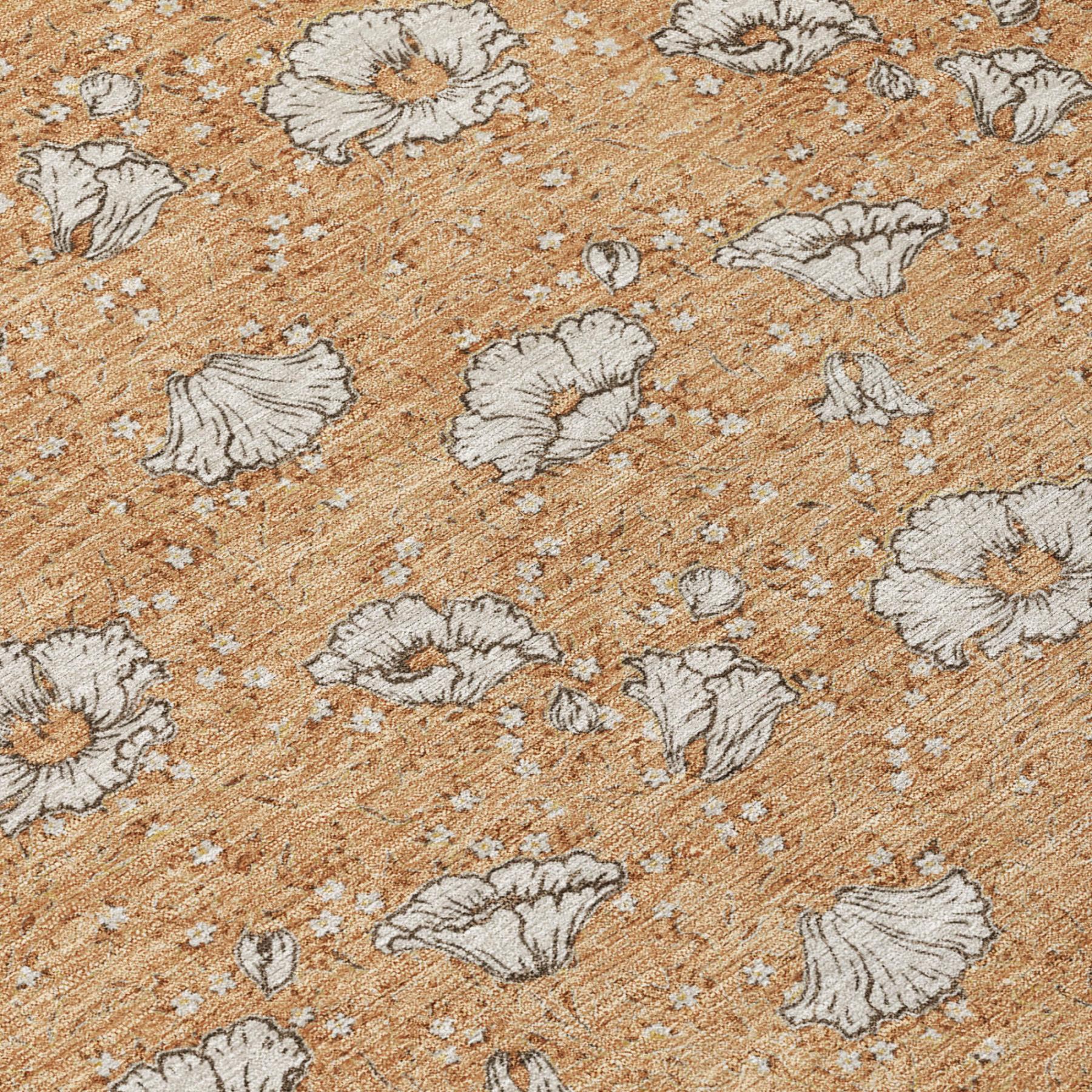 Copper orange rug close-up with light gray floral medallions and textured weave