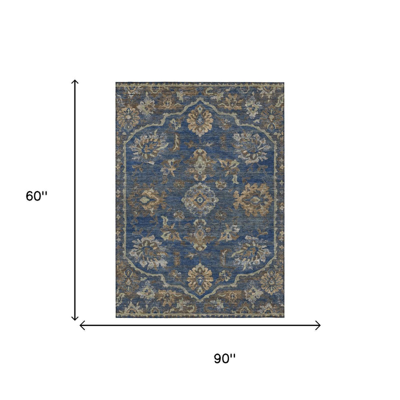 Navy blue area rug with gold and cream medallion pattern, 60 x 90 in