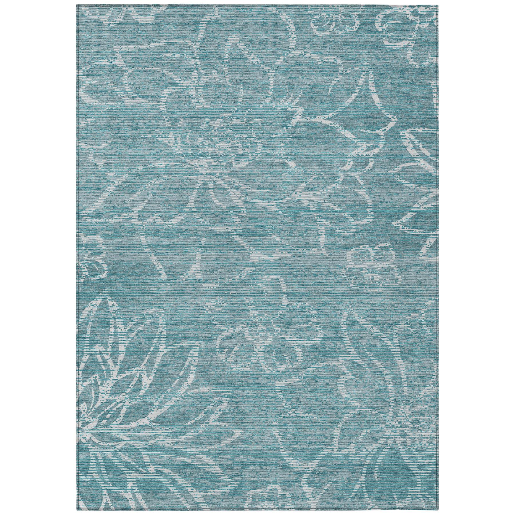Teal-blue area rug with distressed white floral pattern, rectangular flatweave