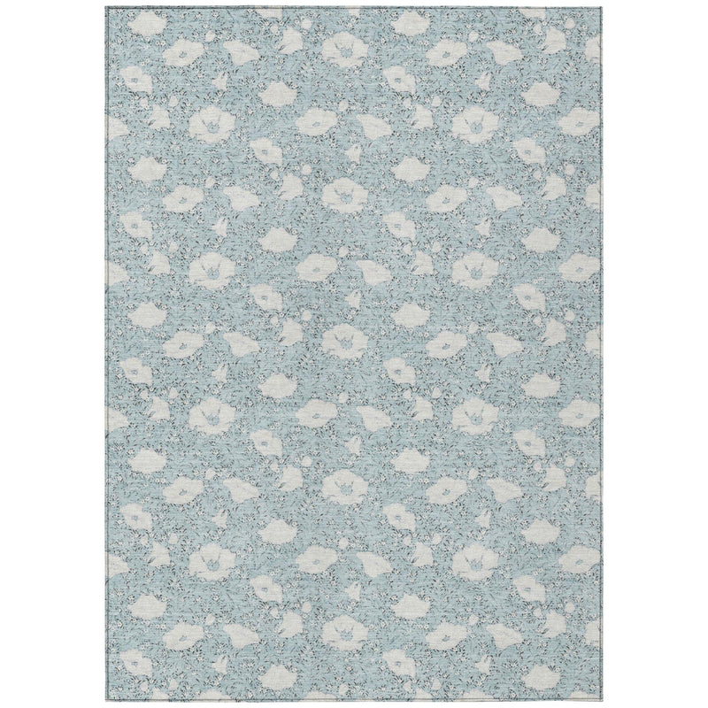 Rectangular washable area rug with light blue floral medallion pattern