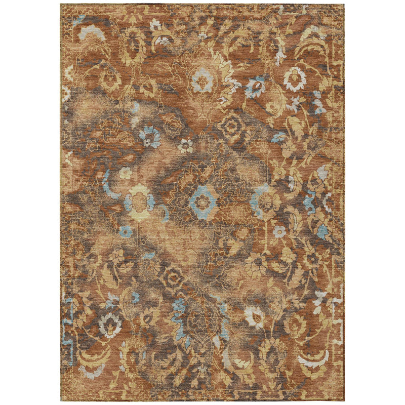 Rectangular floral area rug with distressed orange, rust, and blue pattern