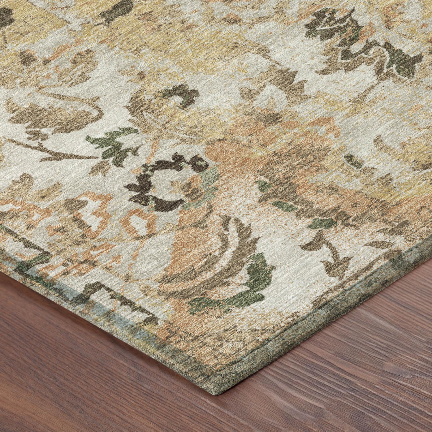 Corner view of distressed floral area rug, textured weave in cream, copper-orange, and dark accents