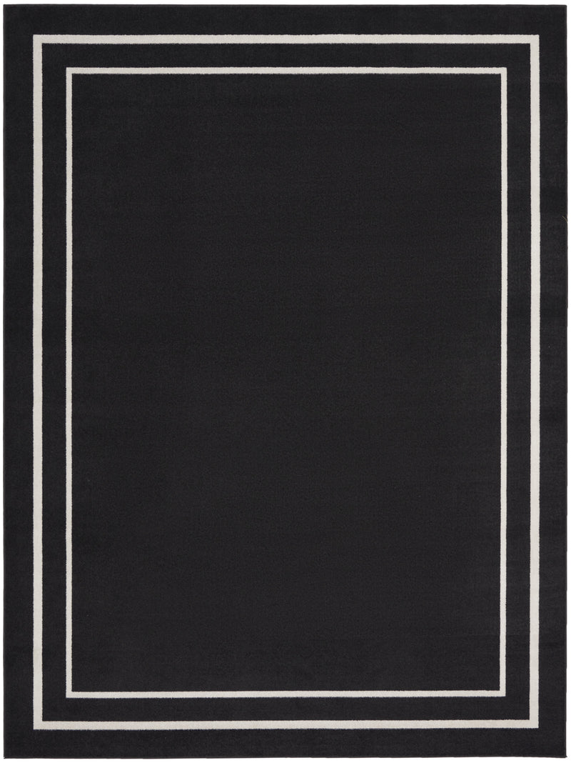 Black and ivory indoor outdoor area rug with centered bordered square pattern